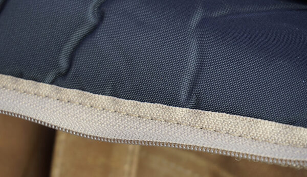 Close-up of the edge of a padded fabric