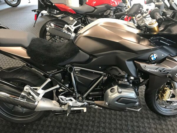 A BMW R1200 RS motorcycle with a soft seat cover